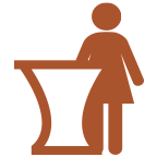 Icon of a receptionist standing behind a counter.